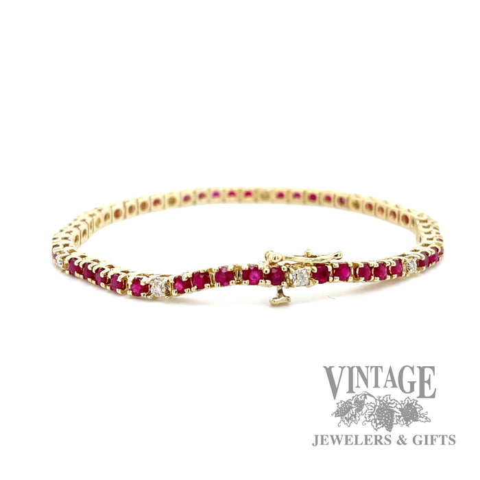 Natural ruby and diamond 14ky gold line bracelet.