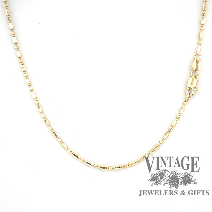 14 karat yellow gold 25” alternating round/oval bead chain