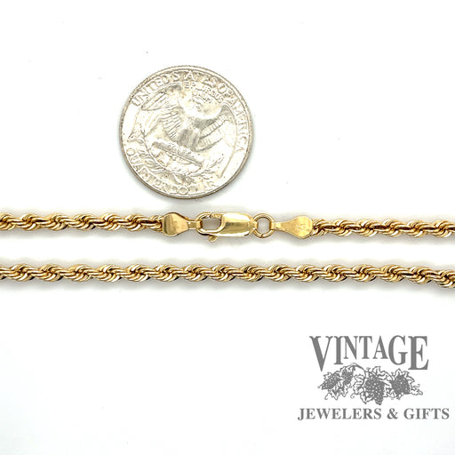 16” 14 karat yellow gold 3.1 mm solid rope chain, shown with quarter for size reference