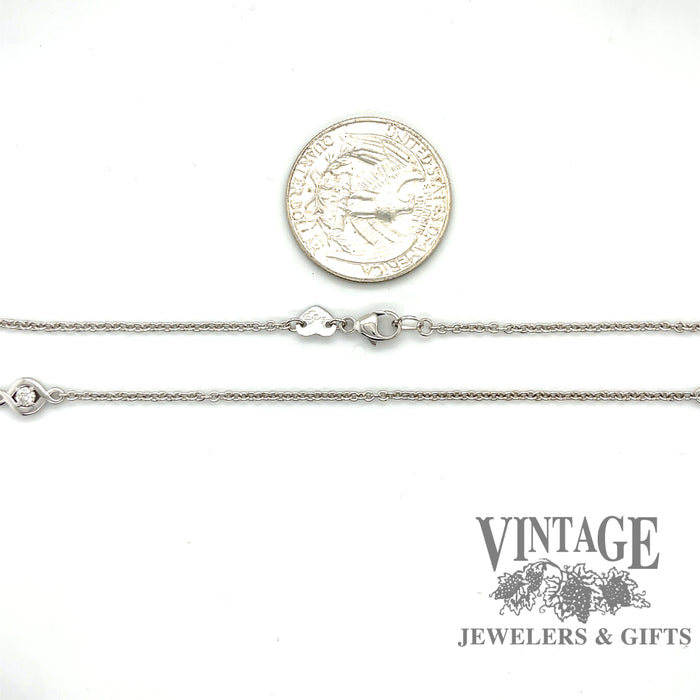 Hearts on Fire 18 karat white gold 40” diamond station chain necklace, shown with quarter for size reference