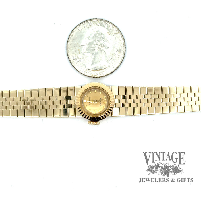 Vintage Ladies slide Rolex 18ky gold watch, with quarter for size reference