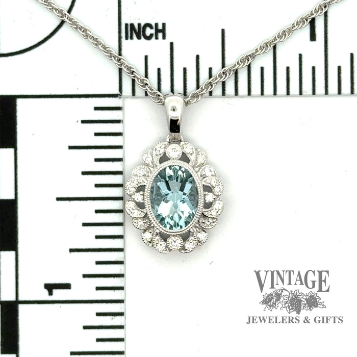 Oval aquamarine and diamond scroll halo 14kw gold necklacescale