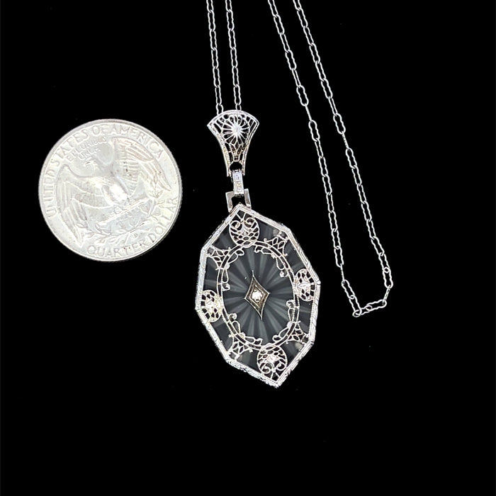 Diamond & crystal pendant with 14kw gold filigree design scale