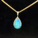 Ethiopian opal set in yellow gold teardrop pendant