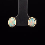 Boulder Opal stud earrings in 14k yellow gold