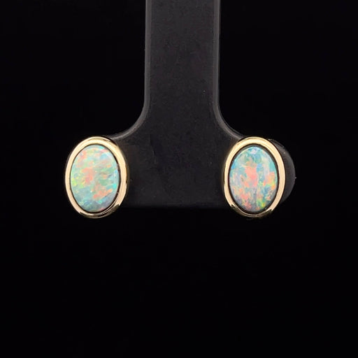 Boulder Opal stud earrings in 14k yellow gold