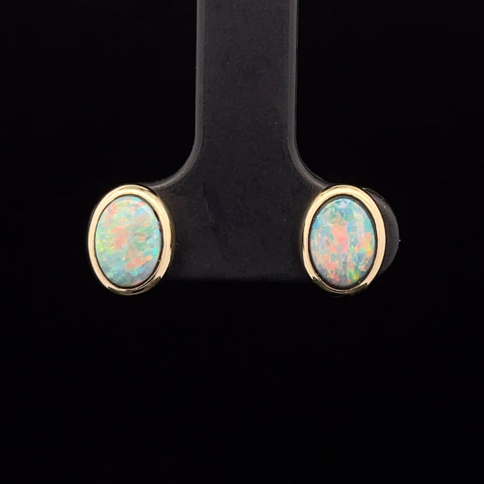 Boulder Opal stud earrings in 14k yellow gold