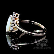 Pear shaped opal and diamond ring side1