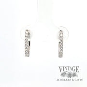 Front 14k white gold oval huggie diamond earring
