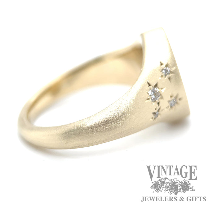 Star set diamond and 14k gold oval signet ring