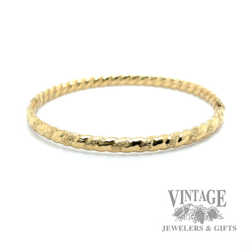 Twisted stripe 14k yellow gold bangle bracelet