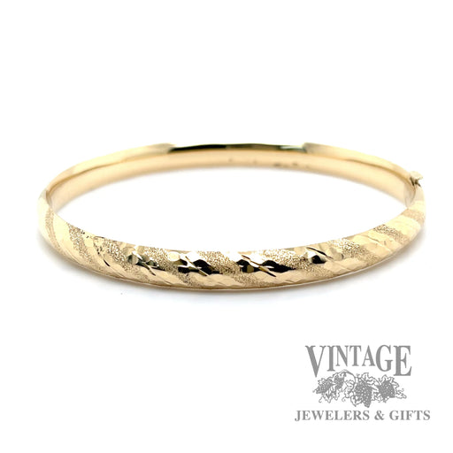 Twisted stripe 14k yellow gold bangle bracelet