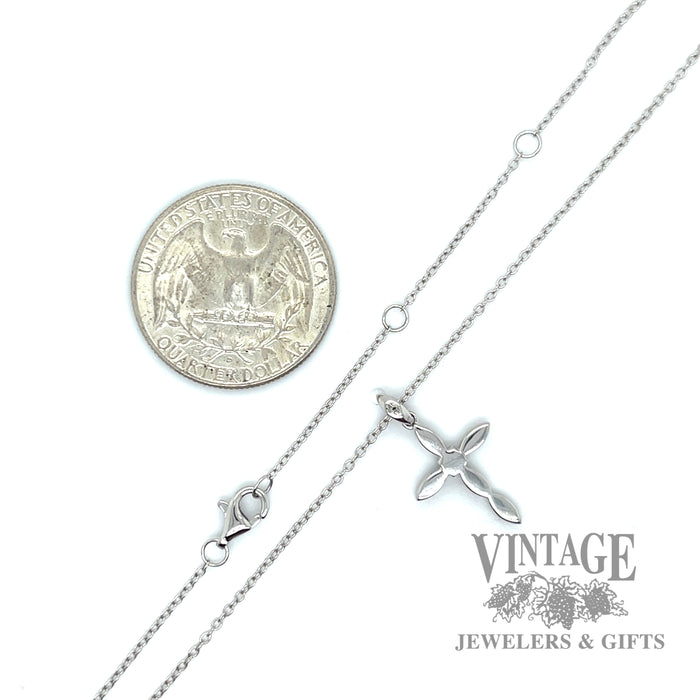 Diamond accent cross of 14k white gold back and scale