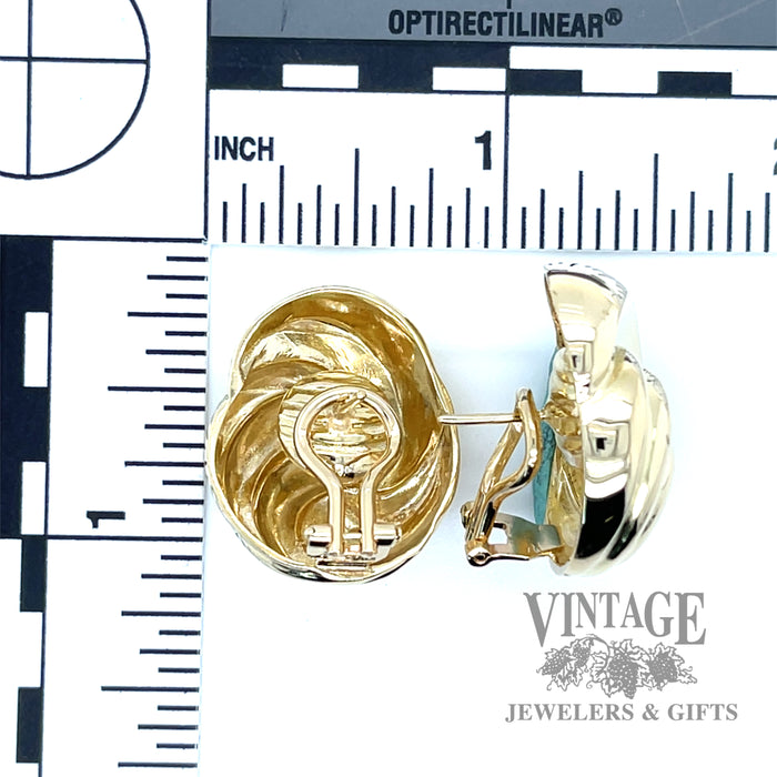 Ridged shell 14k gold omega back button earrings.