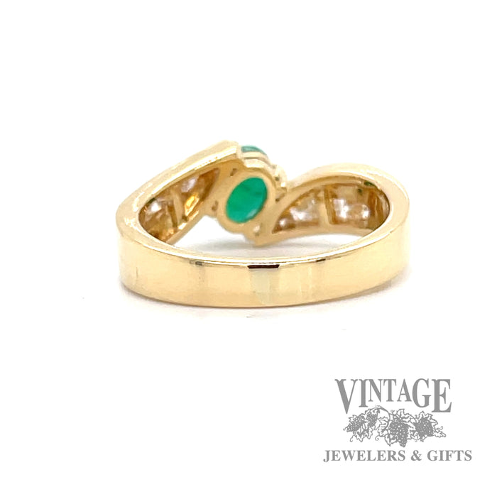 Emerald and diamond accents set in 18k yellow gold bypass ring bottom