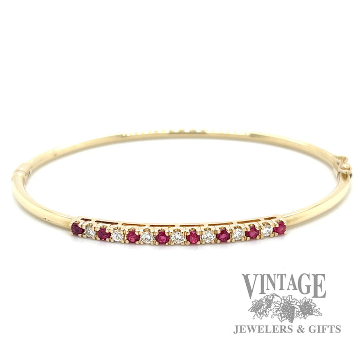 Ruby and diamond accent 14k yellow gold hinged bangle