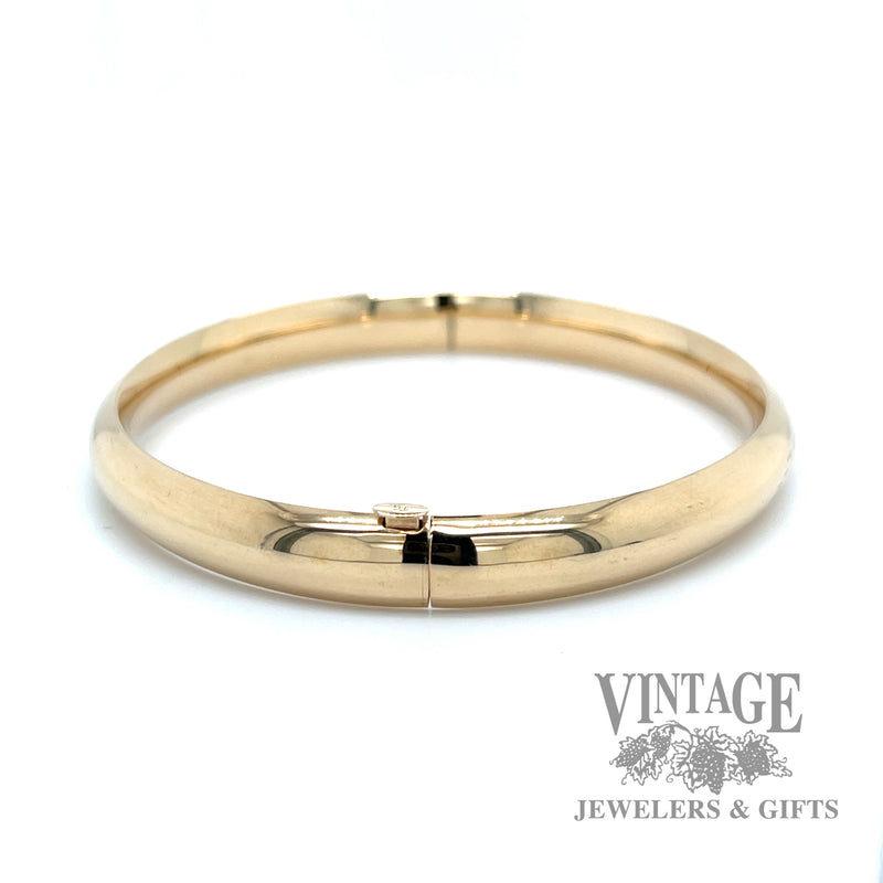 Polished 14k gold hinged bangle bracelet side