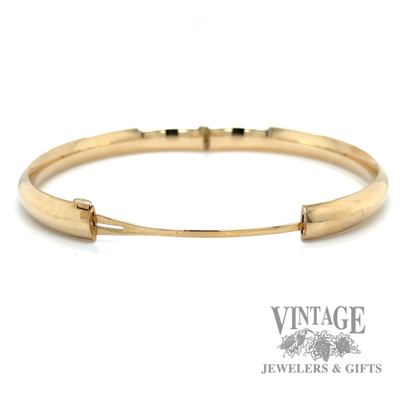 Polished 14k gold hinged bangle bracelet open side