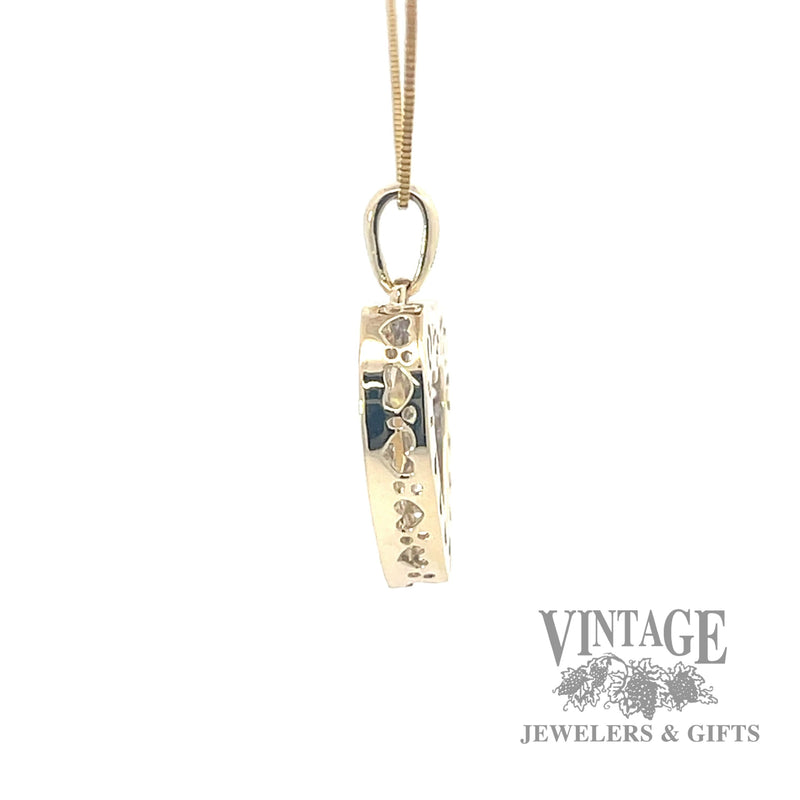 Ruby and diamond 10k gold heart pendant side