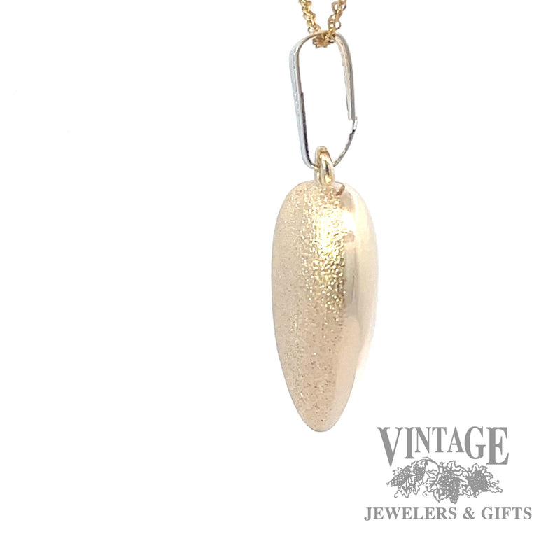 Matte and polished 14k gold heart pendant