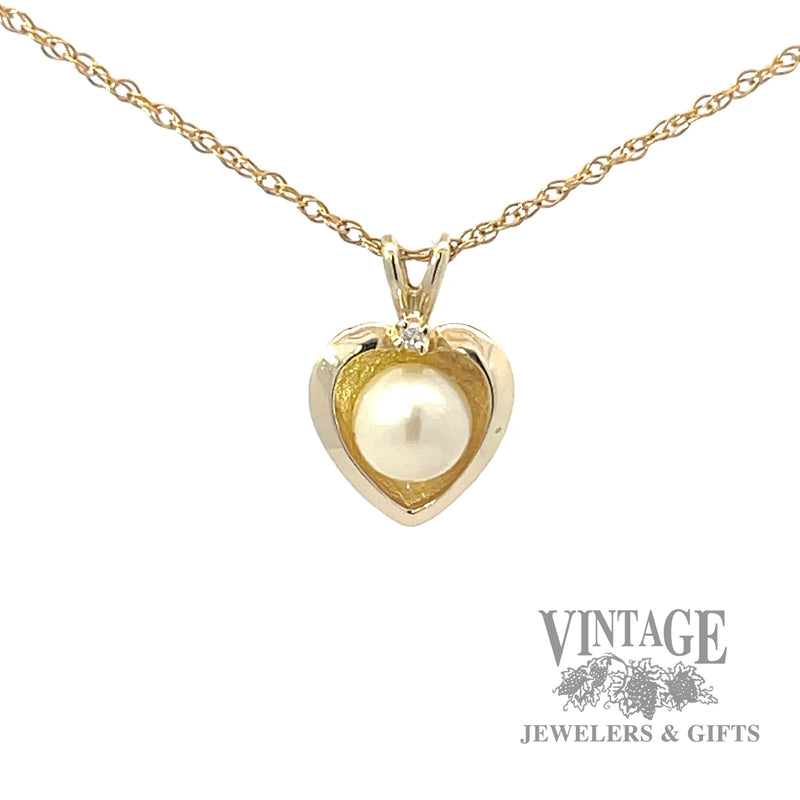 Pearl and diamond 14k gold heart pendant