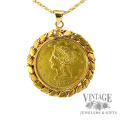 1883 Liberty Gold coin in decorative bezel