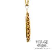 1883 Liberty Gold coin in decorative bezel side