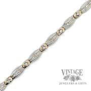 7.25" two tone 14k gold and diamond bracelet