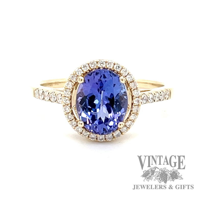 Tanzanite and diamond 14k gold halo ring