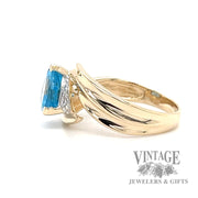 Blue topaz and diamond 14k gold bypass ring side1
