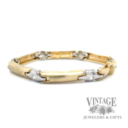 Contemporary 14k two tone gold and diamond link bracelet front