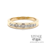 Diamond princess cut 14k channel set ring band.