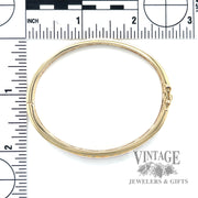 Hinged 14k gold diamond bangle bracelet scale