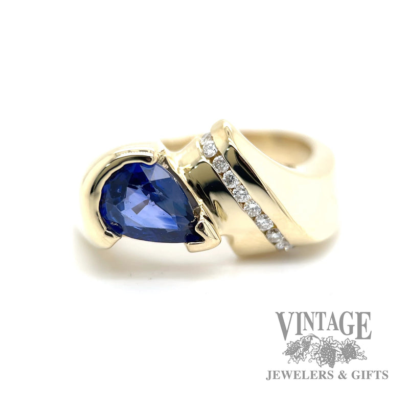 Pear shaped sapphire and diamond 14k gold bypass ring