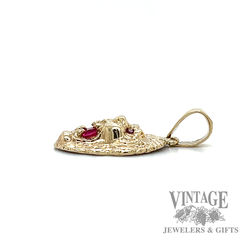 Ruby and 10k gold lion head pendant side