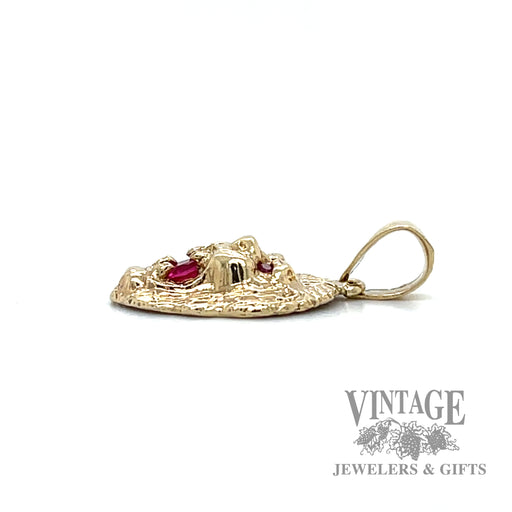 Ruby and 10k gold lion head pendant side