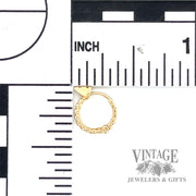 Huggie 14k yellow gold earrings scale