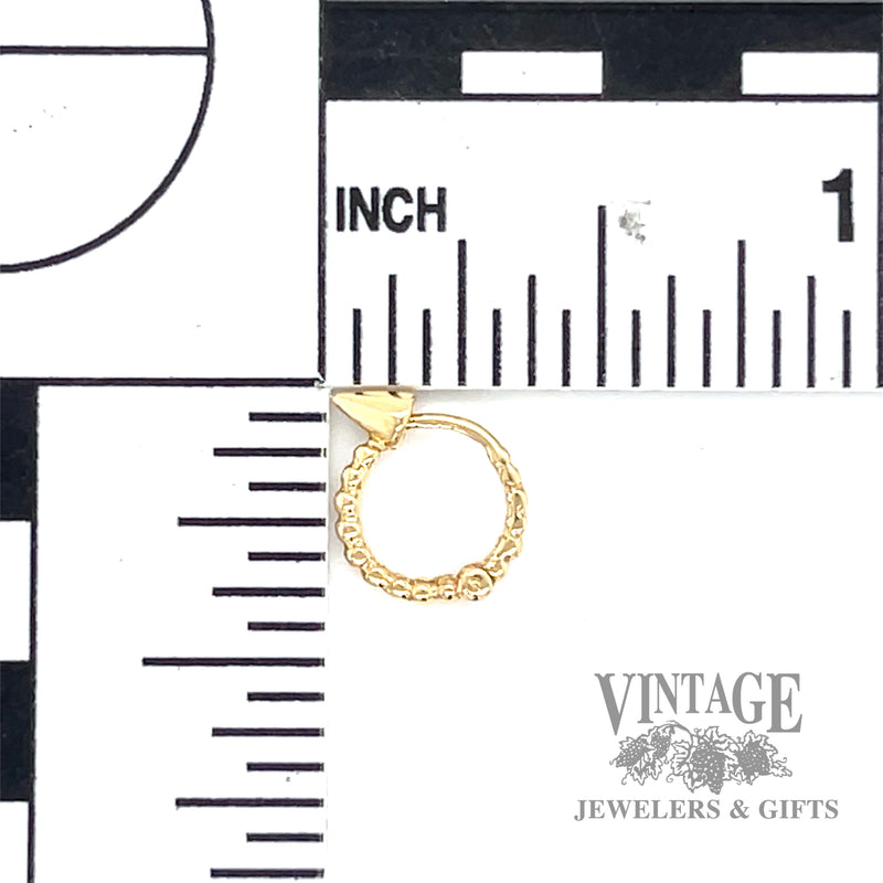 Huggie 14k yellow gold earrings scale
