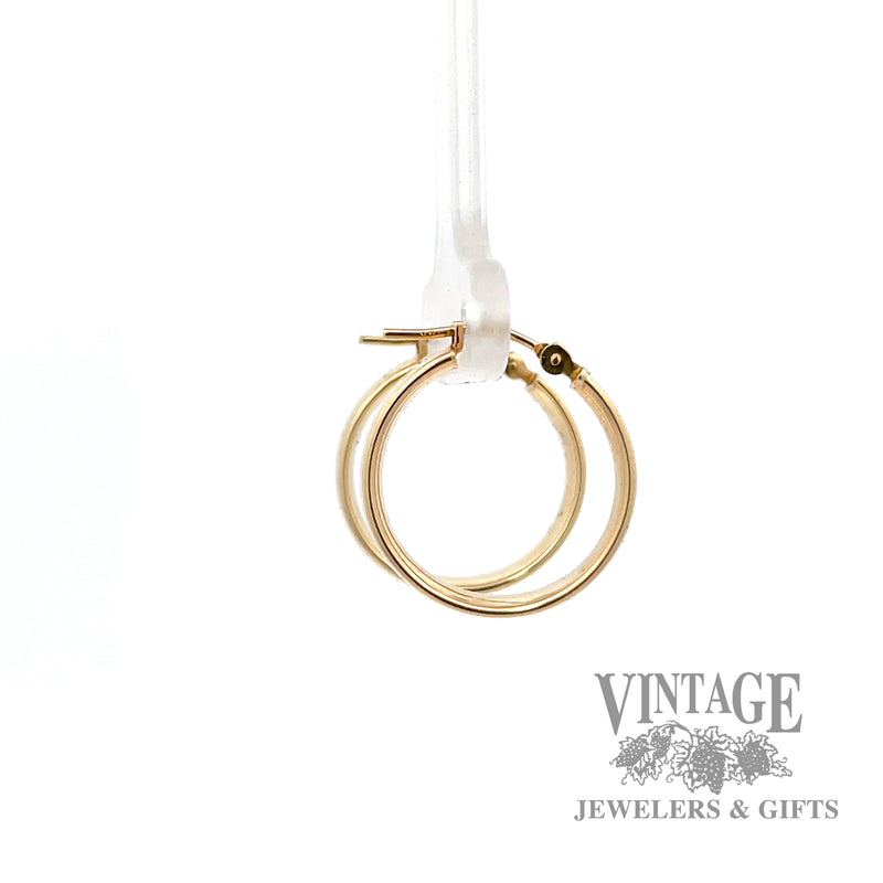 Huggie 14k yellow earrings left