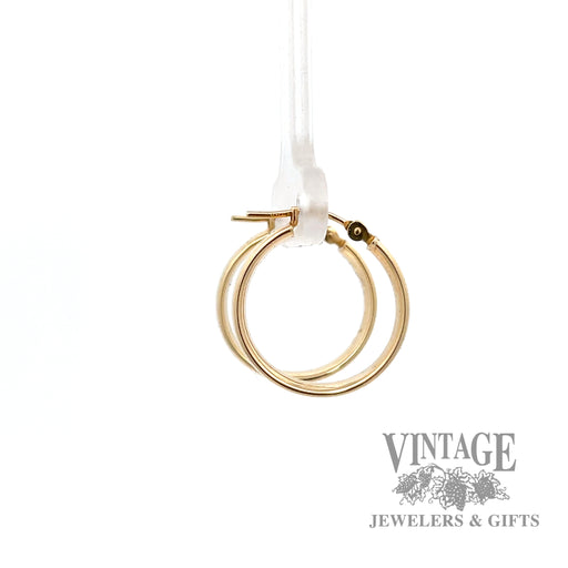 Huggie 14k yellow earrings left