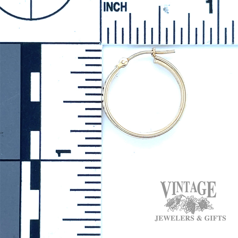 Huggie 14k yellow earrings scale