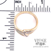 Multiband 13 karat gold two tone diamond bypass ring scale