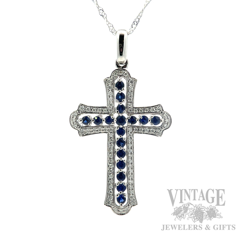 Cross necklace with blue sapphires and diamonds in 14k white gold