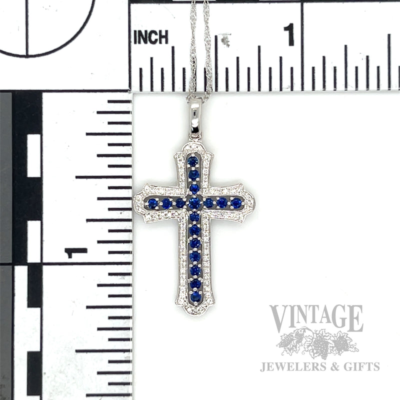 Cross necklace with blue sapphires and diamonds in 14k white gold