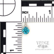 Blue Zircon 14k white gold solitaire pendant. scale