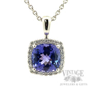 Cushion shaped tanzanite and diamond 14k white gold halo pendant Front