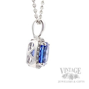 Cushion shaped tanzanite and diamond 14k white gold halo pendant side