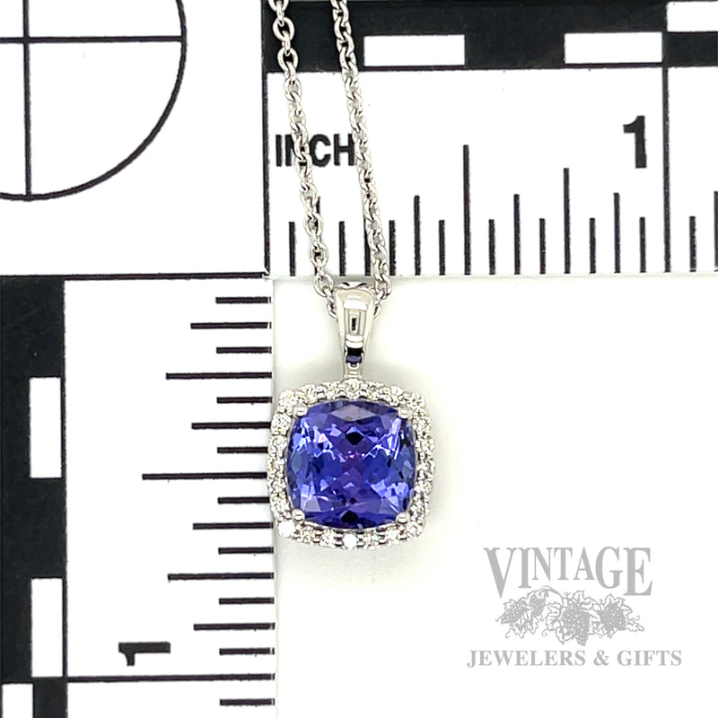 Cushion shaped tanzanite and diamond 14k white gold halo pendant
