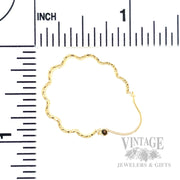 Freeform hammered 14k gold hoops scale