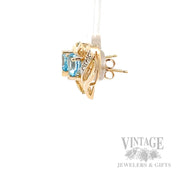 Heart shaped Swiss blue topaz and gold earrings side